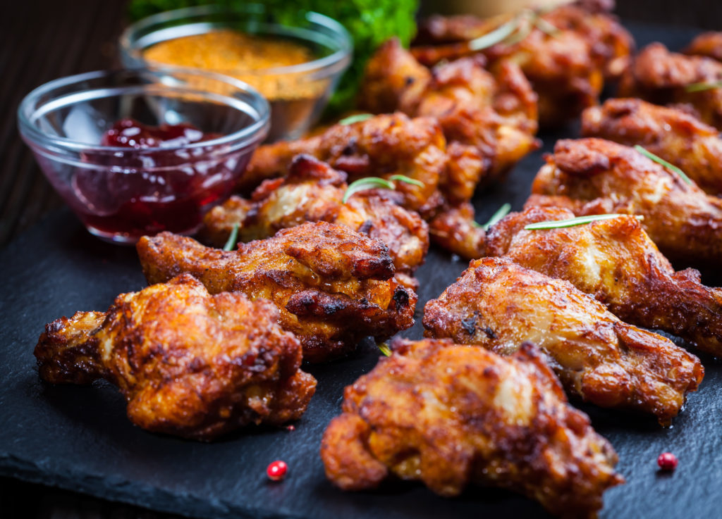 BBQ chicken wings with spices and dips