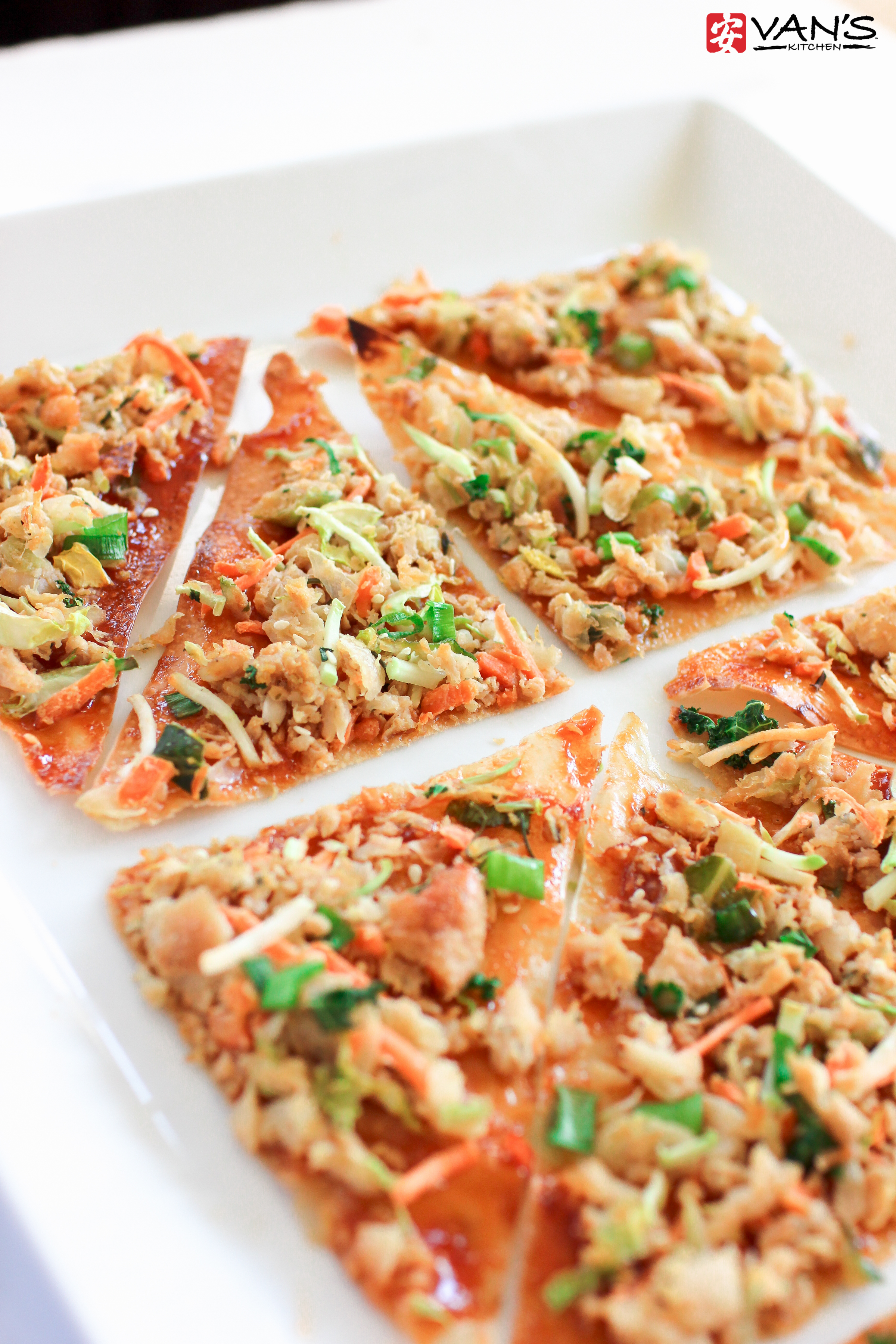 Make thin, crispy chicken egg roll pizza in only 10 minutes! It's a healthy and flavorful recipe that's perfect for weeknights or parties.