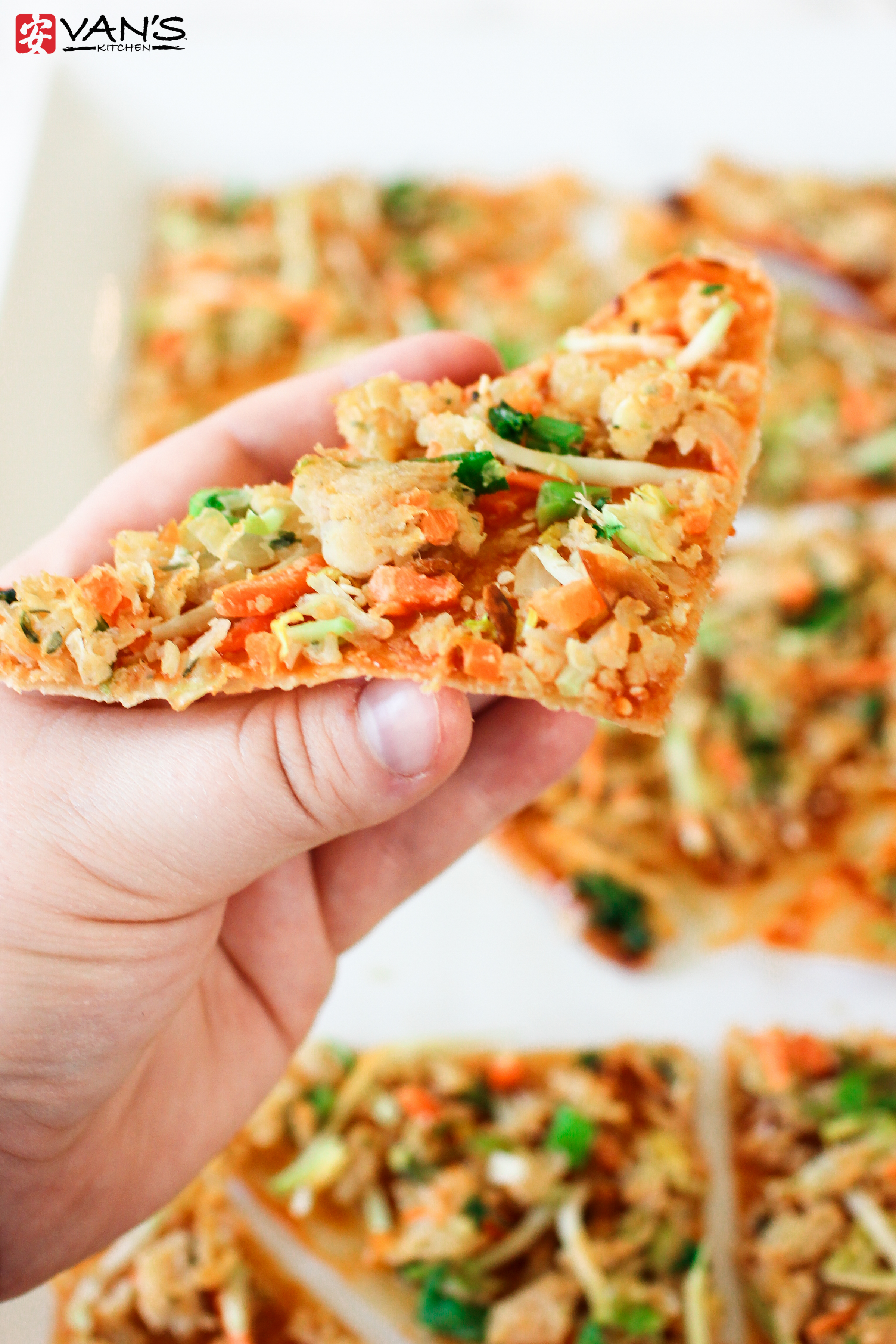 Make thin, crispy chicken egg roll pizza in only 10 minutes! It's a healthy and flavorful recipe that's perfect for weeknights or parties.